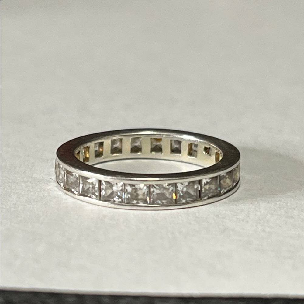 Sterling silver eternity band with channel-set clear CZ gemstones